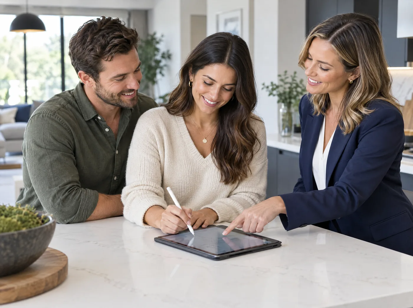 A client signing a contract amendment on a tablet at home